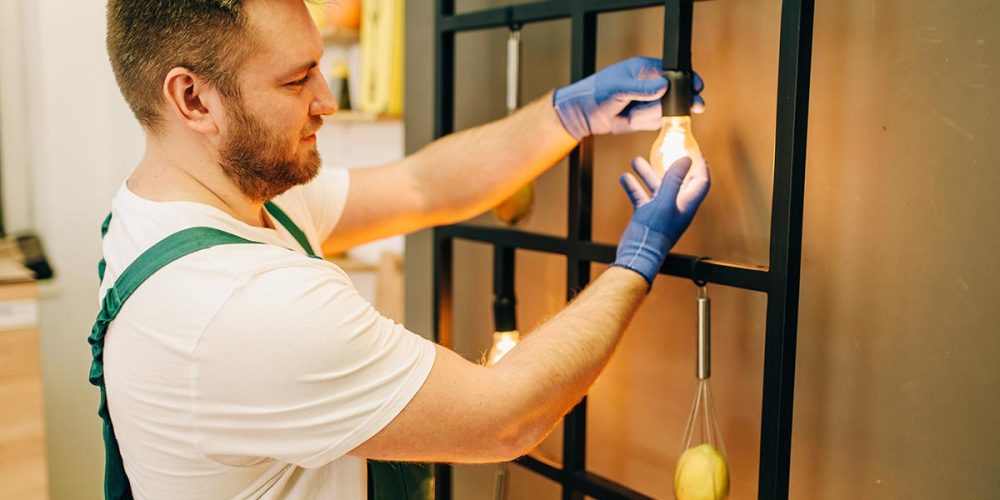 electrician-changes-the-light-bulb-handyman-resize.jpg
